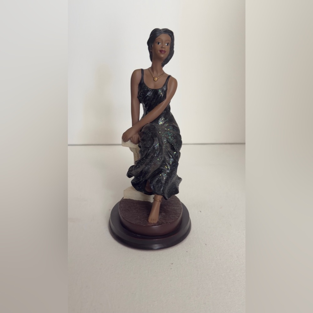 Elegant Black Figurine with Glitter Accents